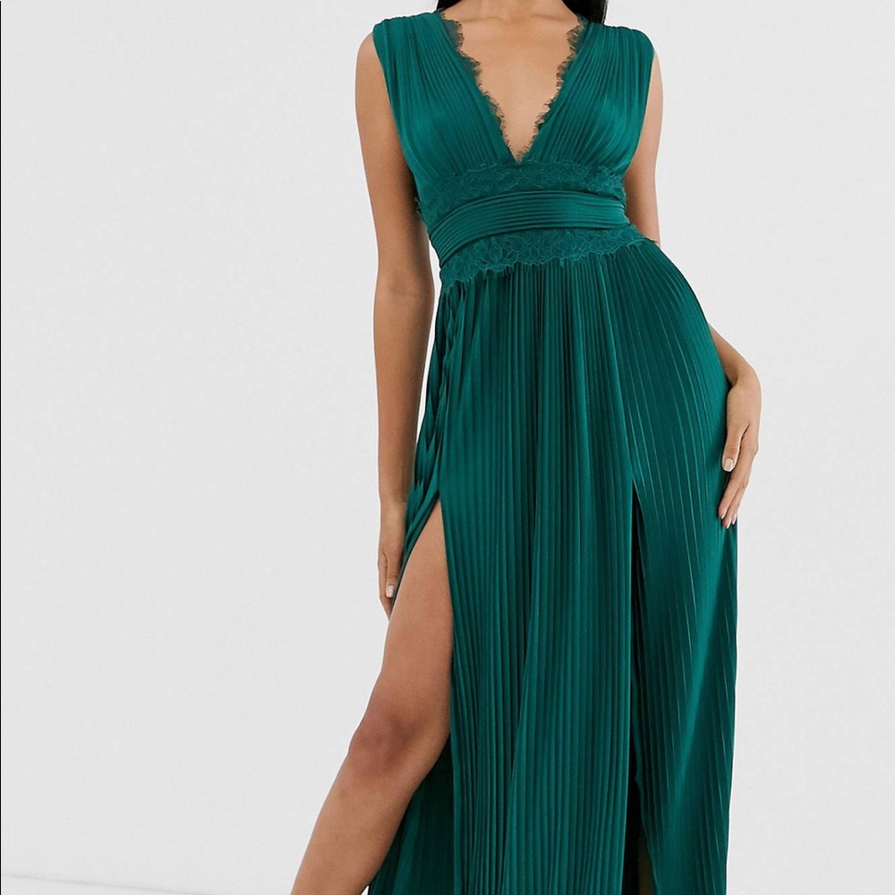 Double slit deep V, pleated green emerald dress.